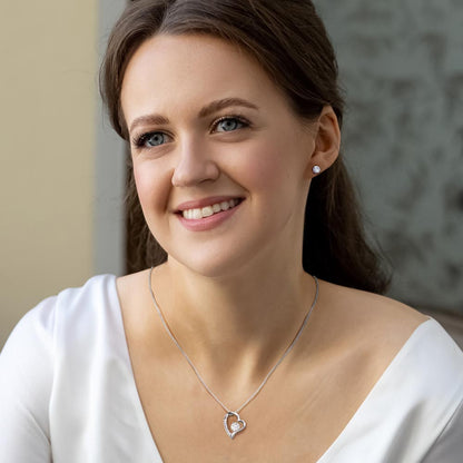 Smiling woman in a white top wearing the Forever Love set | Forever Love Necklace and Earring Set