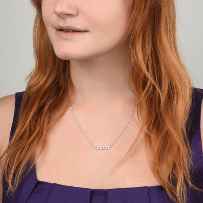Silver name necklace worn with a purple top | Chosen Name Necklace