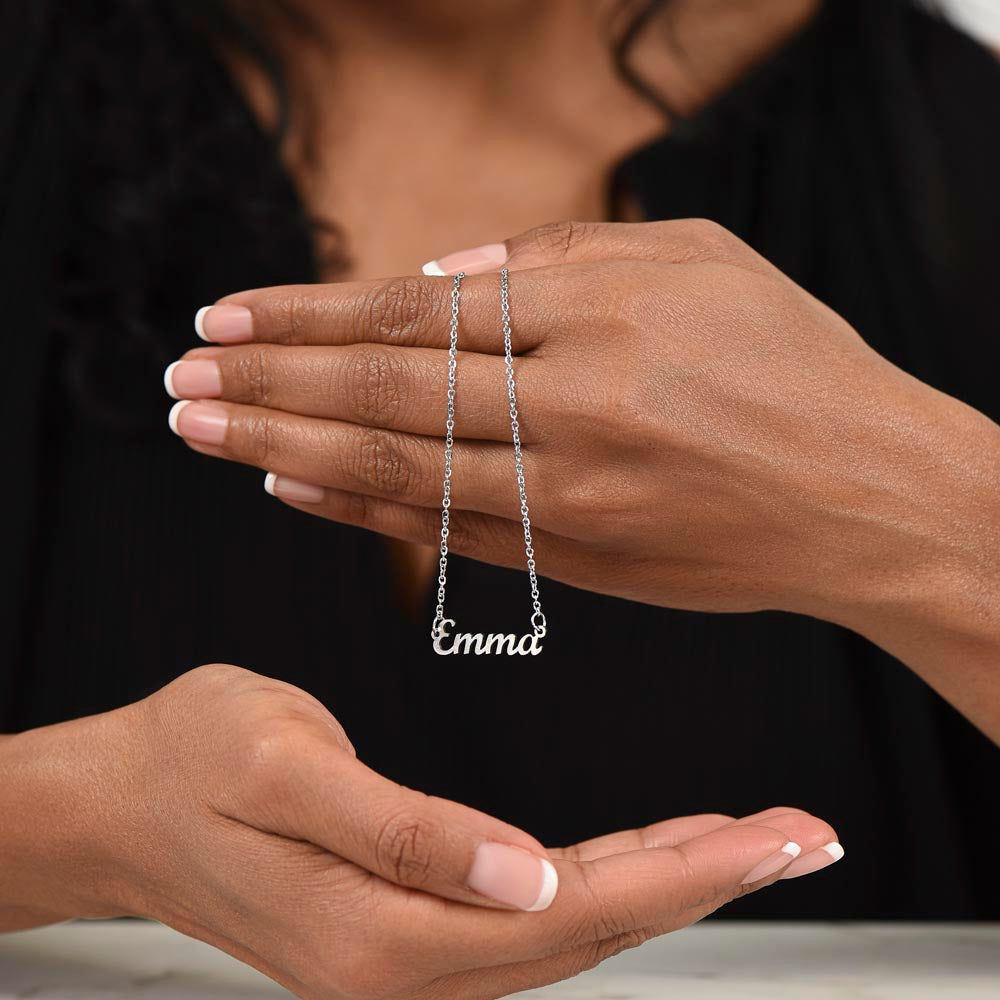 Silver name necklace held in both hands | Chosen Name Necklace