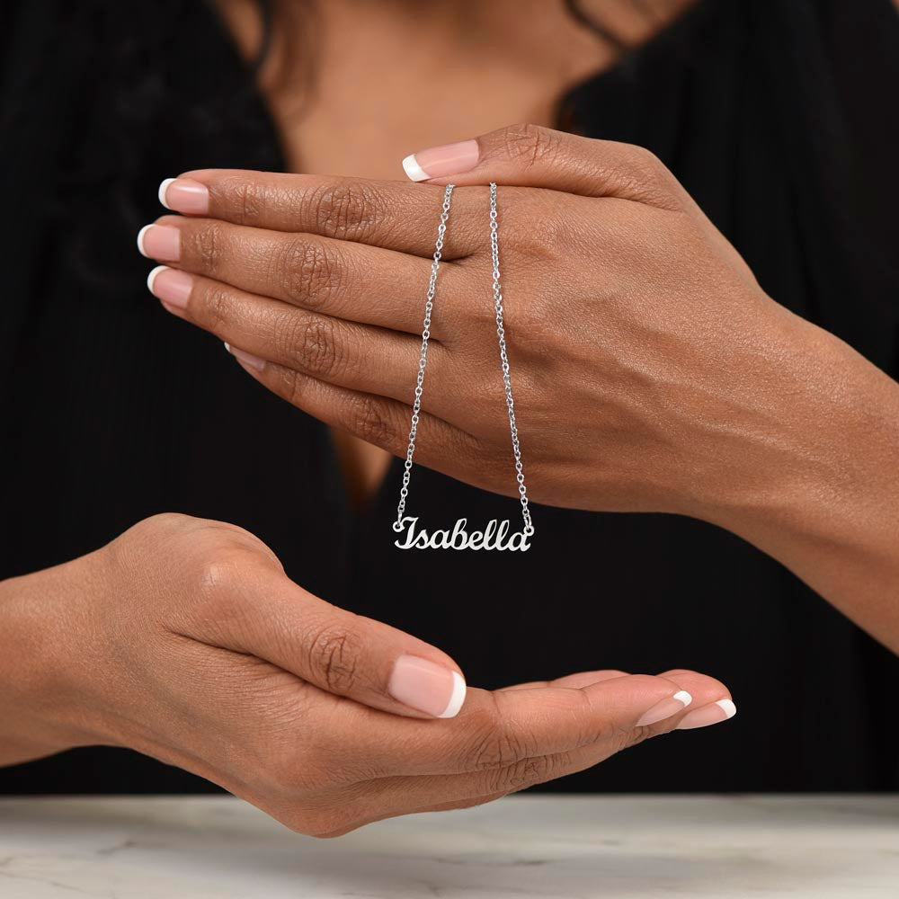 Silver name necklace draped over the fingers | Chosen Name Necklace