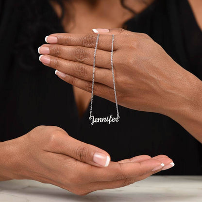 Silver name necklace draped over the hand | Chosen Name Necklace