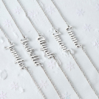Several silver name necklaces on a white background | Chosen Name Necklace