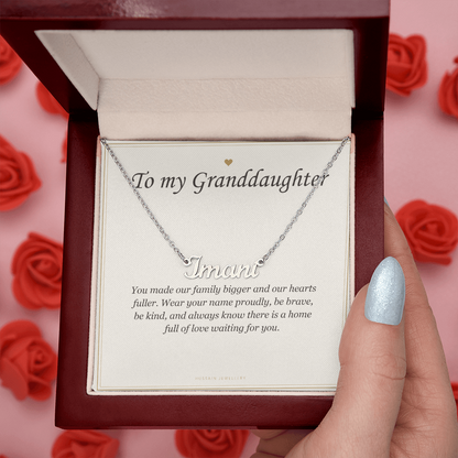 Hand opening the mahogany Luxury Box among red roses | Granddaughter Name Necklace with Message Card