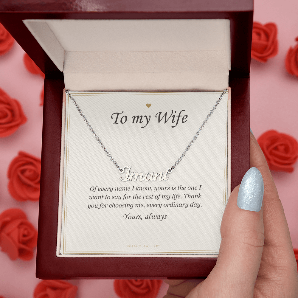 Hand opening the mahogany Luxury Box among red roses | Wife Name Necklace with Message Card
