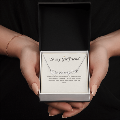 Hands holding the gift box with the steel heart name pendant and card | Girlfriend Heart Name Necklace with Message Card