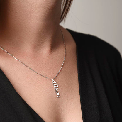Woman in a black top wearing the steel vertical name necklace | Vertical Name Necklace
