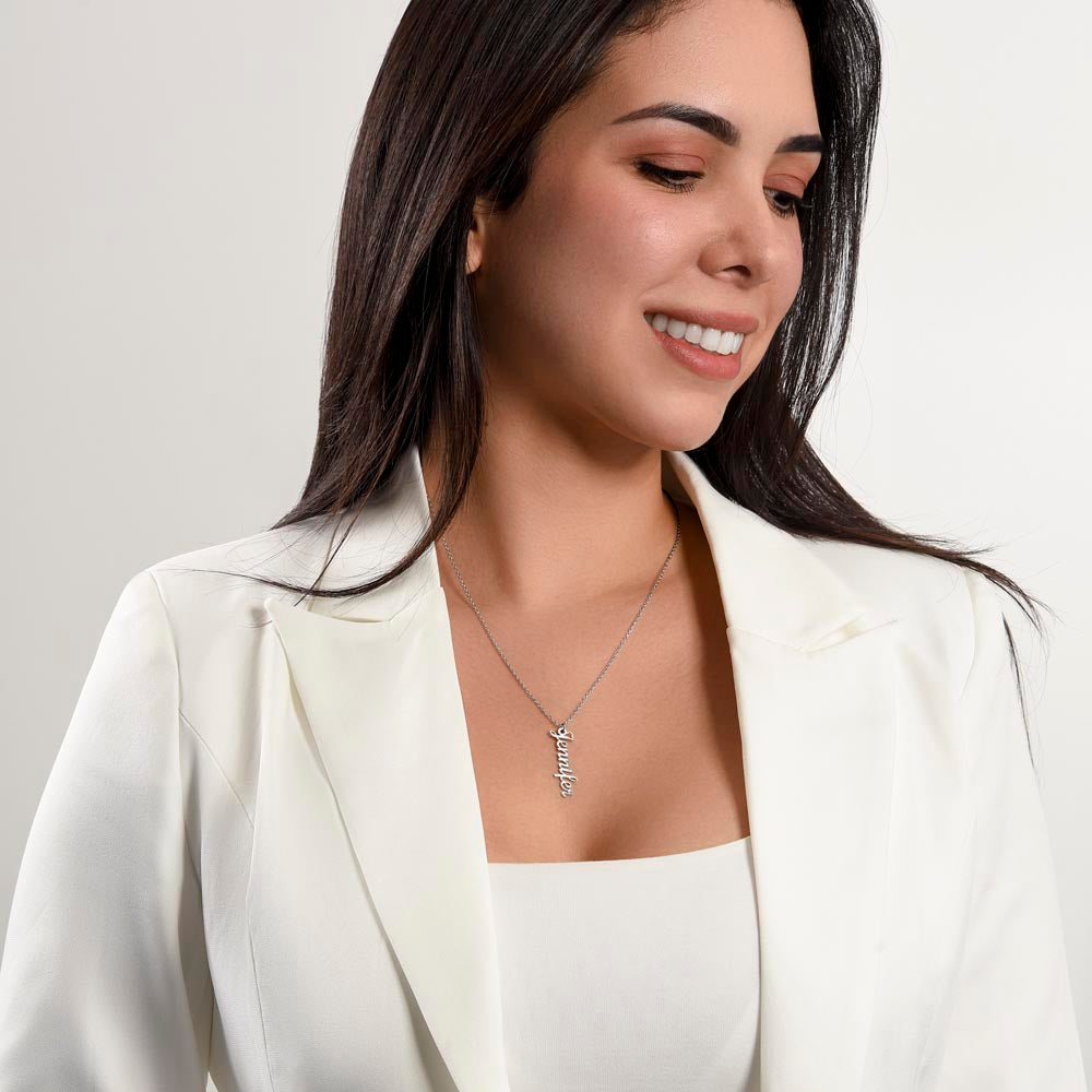 Woman in a white blazer wearing the vertical name necklace | Vertical Name Necklace