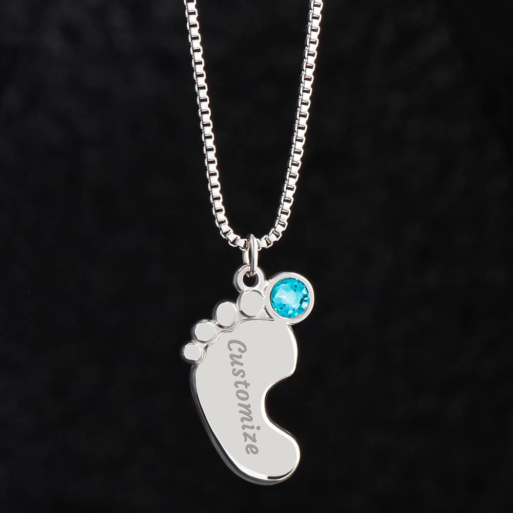 Silver baby feet pendant with a blue birthstone on black | Baby Feet Birthstone Necklace