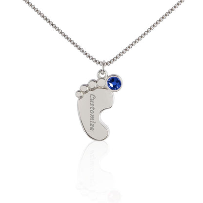 Silver baby feet pendant with a blue birthstone on white | Baby Feet Birthstone Necklace