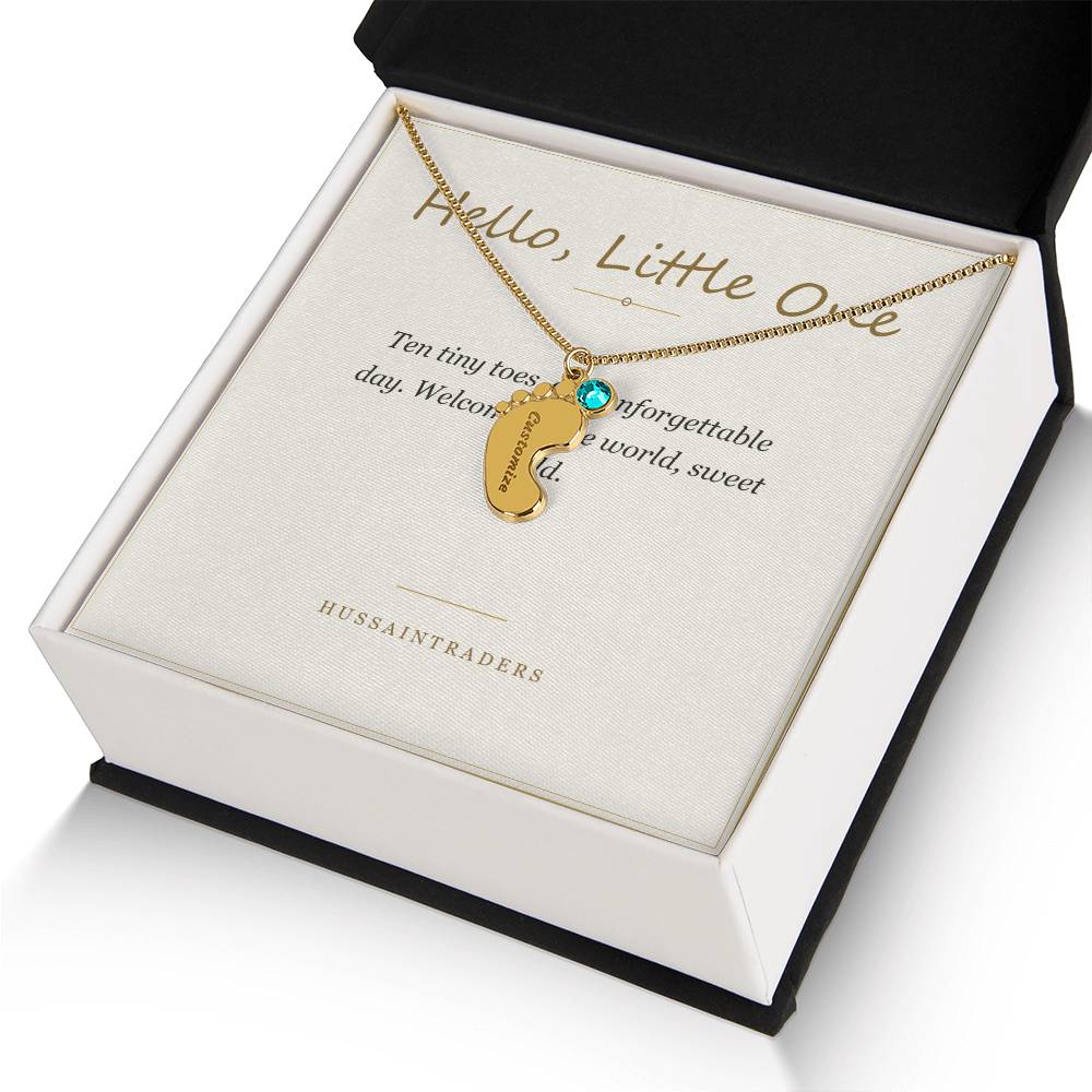 Gold finish charm and card in an open gift box | Baby Feet Birthstone Necklace