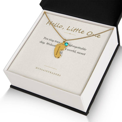 Gold finish charm and card in an open gift box | Baby Feet Birthstone Necklace