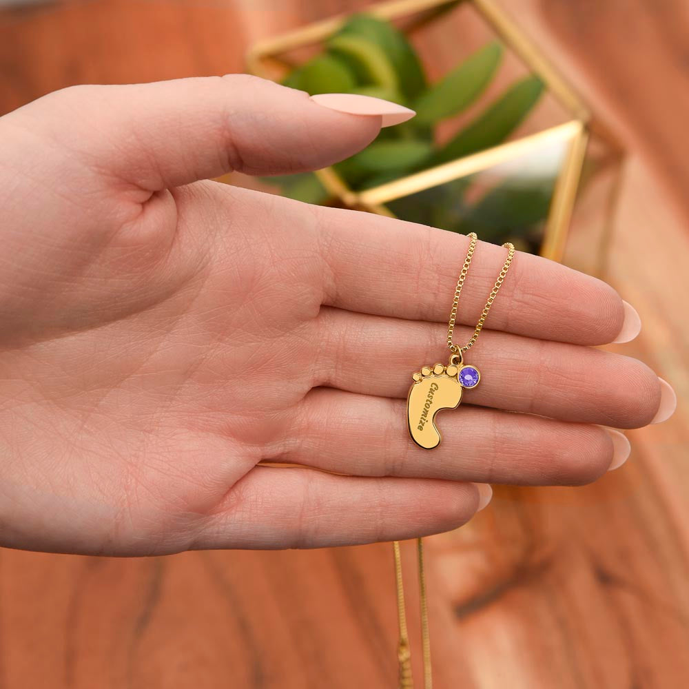 Gold finish baby feet charm in the palm | Baby Feet Birthstone Necklace