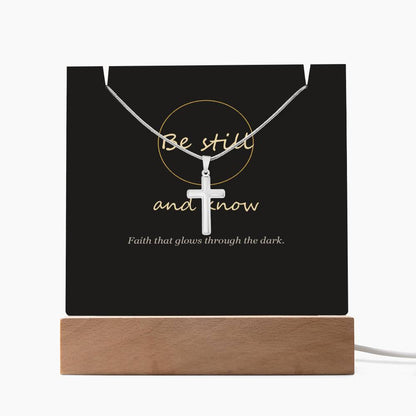 Be still and know cross acrylic keepsake light with necklace on a wood LED base, white background | Be Still Keepsake Light & Cross Necklace