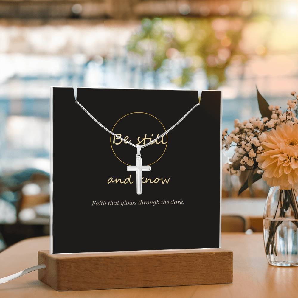 Be still and know cross keepsake light beside flowers | Be Still Keepsake Light & Cross Necklace