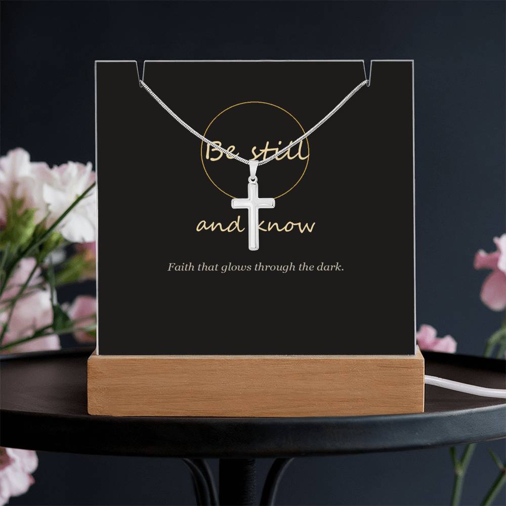 Be still and know cross keepsake light on a dark table | Be Still Keepsake Light & Cross Necklace