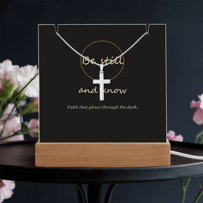 Be still and know cross keepsake light on a dark table | Be Still Keepsake Light & Cross Necklace