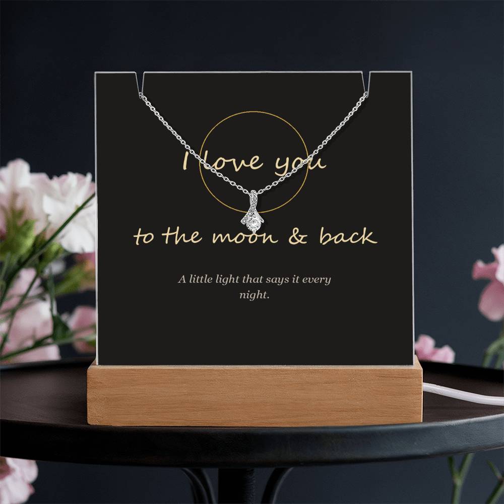 I love you to the moon and back keepsake light on a dark table | To the Moon & Back Keepsake Light & Necklace