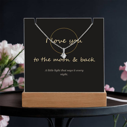 I love you to the moon and back keepsake light on a dark table | To the Moon & Back Keepsake Light & Necklace