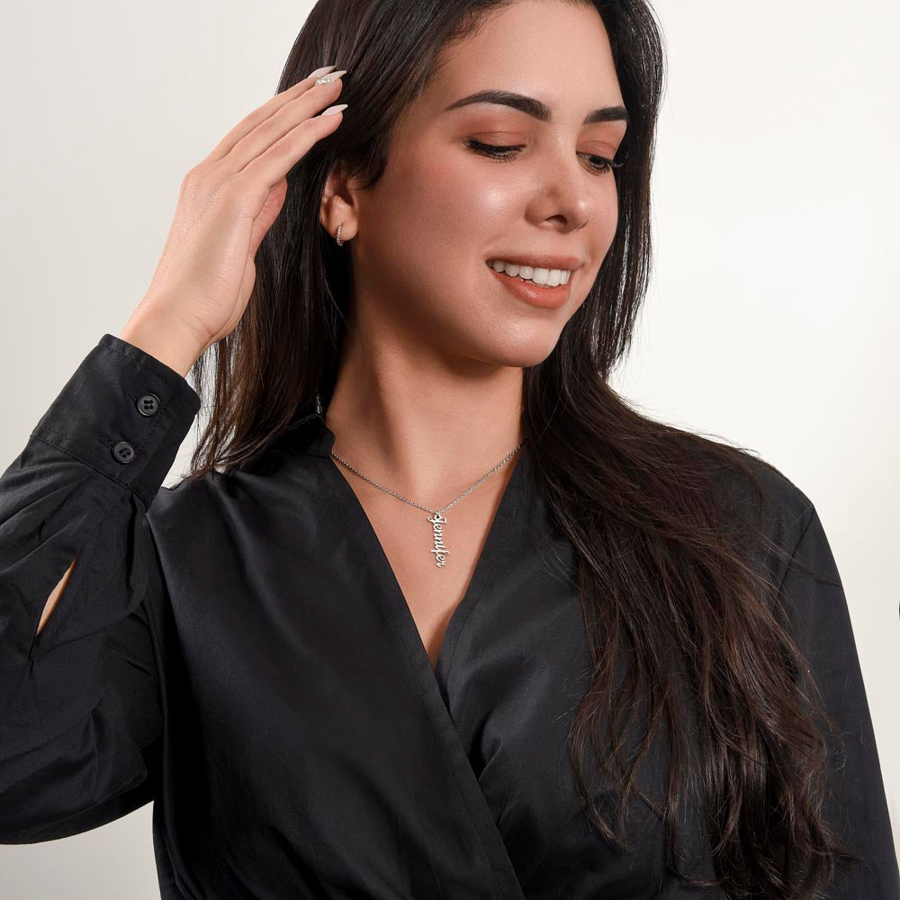 Silver vertical name necklace worn with a black blouse | Stacked Vertical Names Necklace