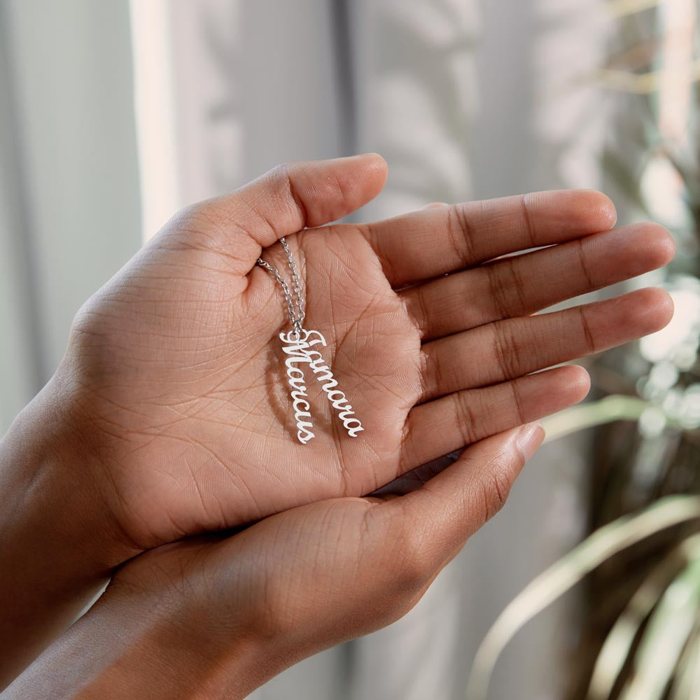 Three silver vertical names held in the palm | Stacked Vertical Names Necklace