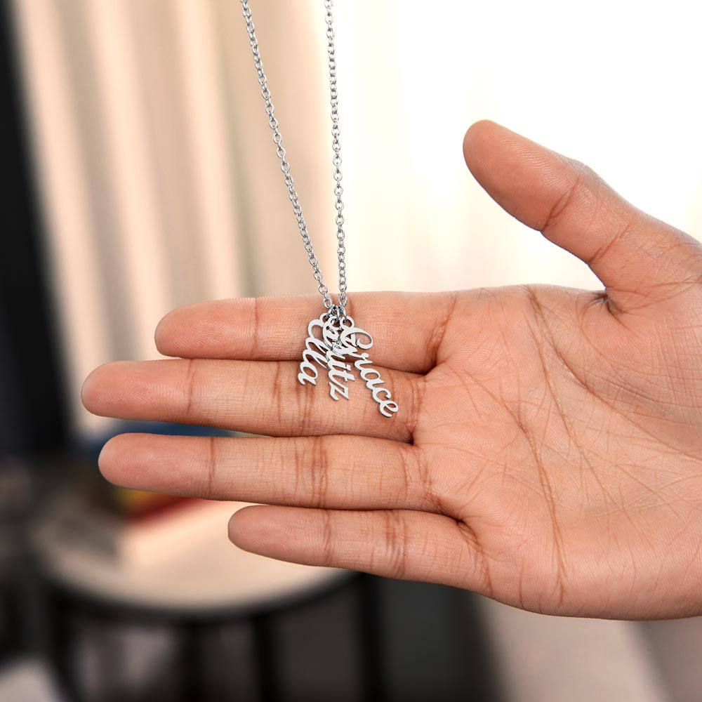 Three silver vertical names held in an open hand | Stacked Vertical Names Necklace
