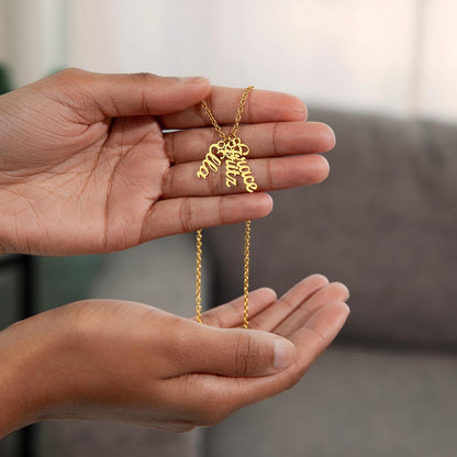 Three gold finish vertical names held in the hands | Stacked Vertical Names Necklace