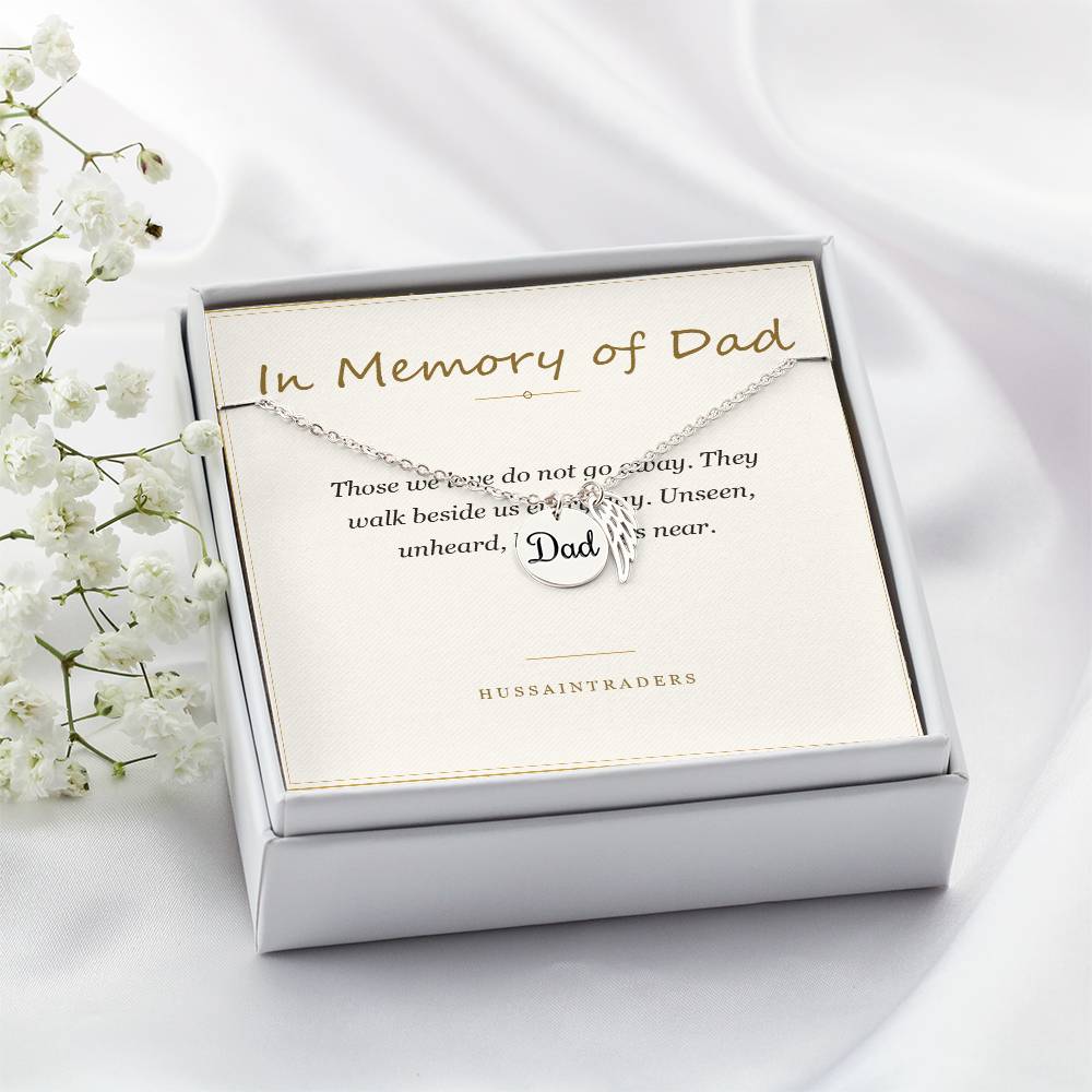 Boxed silver necklace and card beside white flowers, angled | Memorial Necklace for Dad