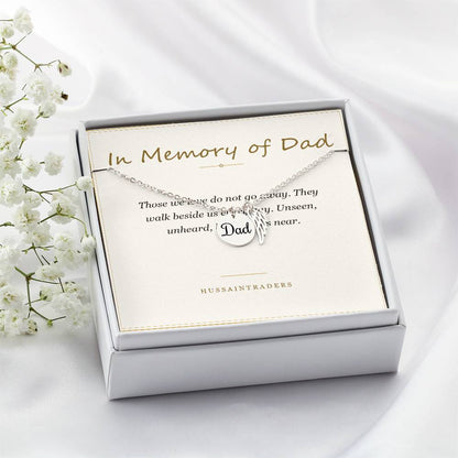 Boxed silver necklace and card beside white flowers, angled | Memorial Necklace for Dad
