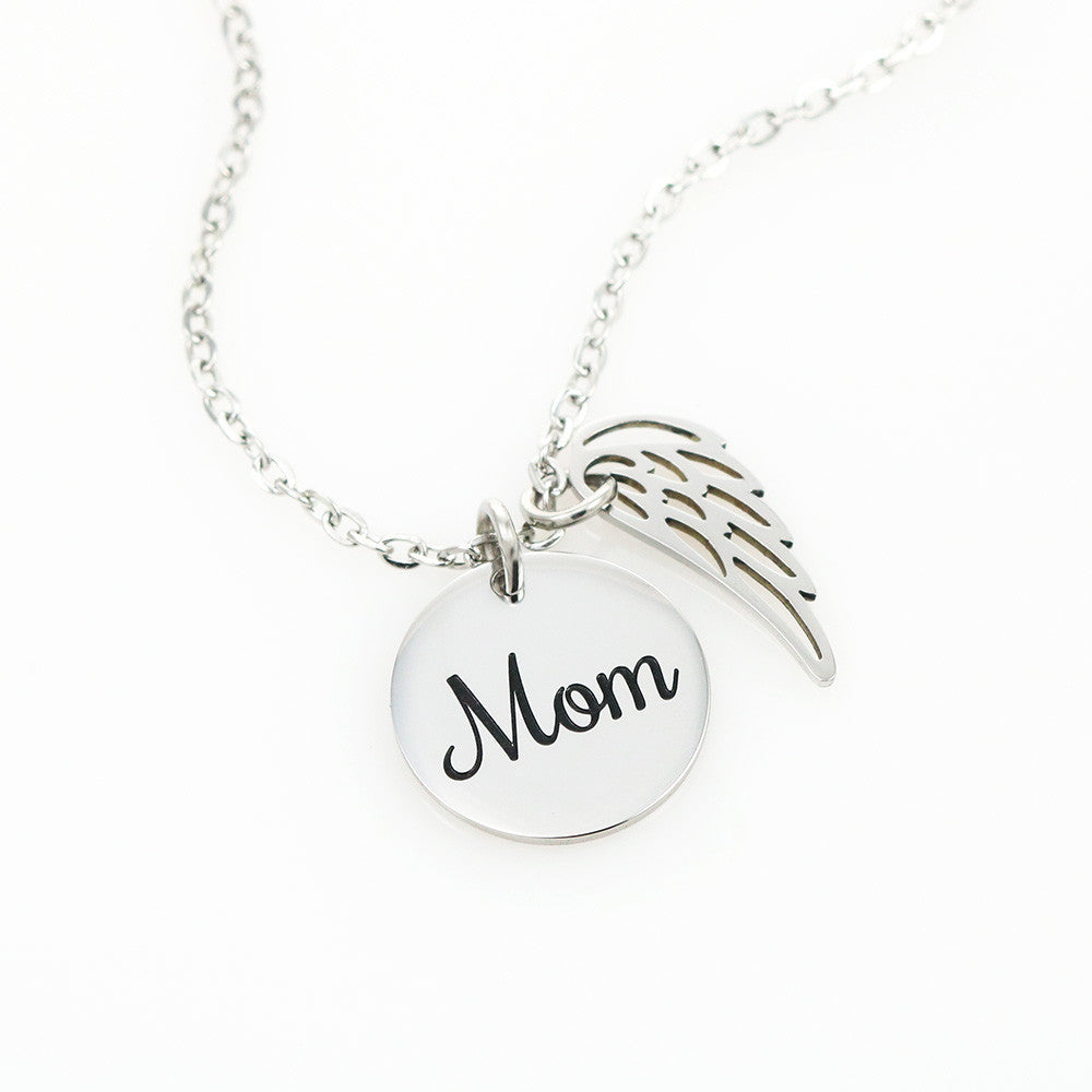 Silver Mom disc and wing necklace on a white background | Memorial Necklace for Mom