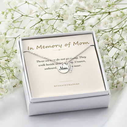 Boxed silver necklace and card beside white flowers | Memorial Necklace for Mom