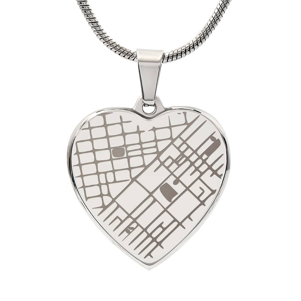 Steel heart pendant engraved with a street map, on a white background | Engraved Coordinates Heart Necklace