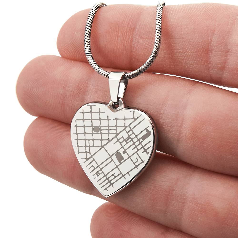 Hand holding the steel map heart pendant | Engraved Coordinates Heart Necklace