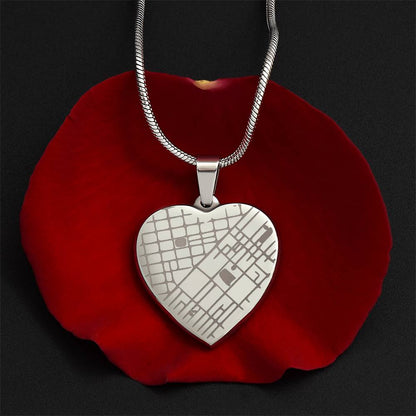 Steel map heart pendant on a red rose petal | Engraved Coordinates Heart Necklace