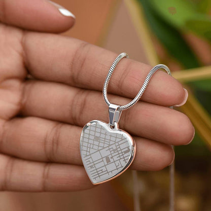 Fingers holding the steel map heart pendant | Engraved Coordinates Heart Necklace