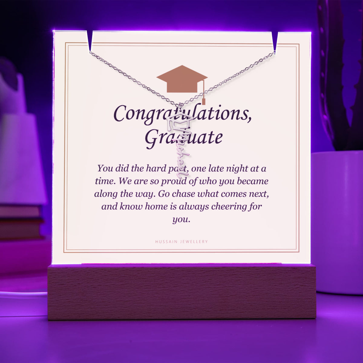 Graduate keepsake glowing purple on its LED base, with the name necklace | Graduation Cap Name Necklace and Keepsake Light