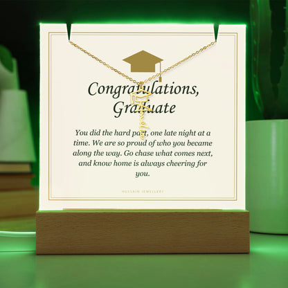 Graduate keepsake glowing green, with the gold finish name necklace | Graduation Cap Name Necklace and Keepsake Light