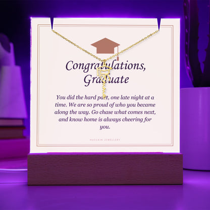 Graduate keepsake glowing purple, with the gold finish name necklace | Graduation Cap Name Necklace and Keepsake Light