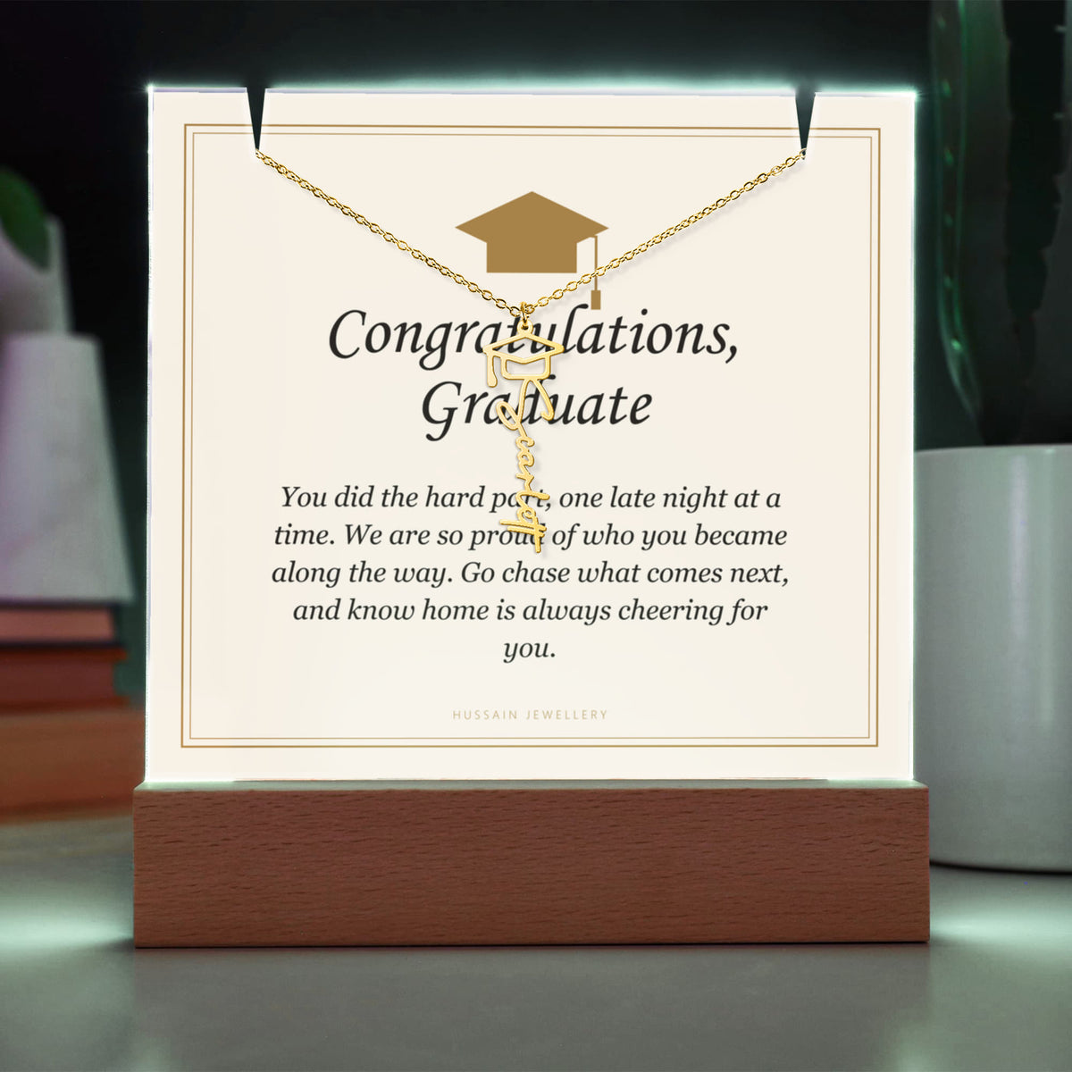 Graduate keepsake glowing green, with the gold finish name necklace | Graduation Cap Name Necklace and Keepsake Light