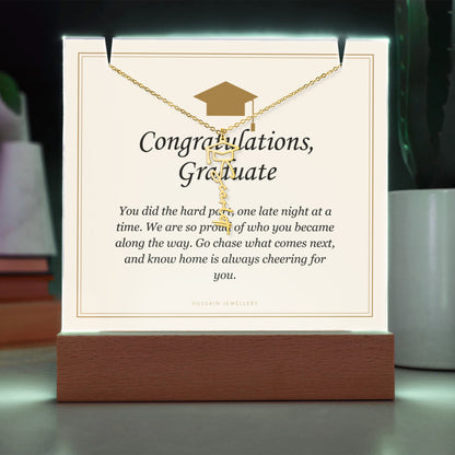 Graduate keepsake glowing green, with the gold finish name necklace | Graduation Cap Name Necklace and Keepsake Light