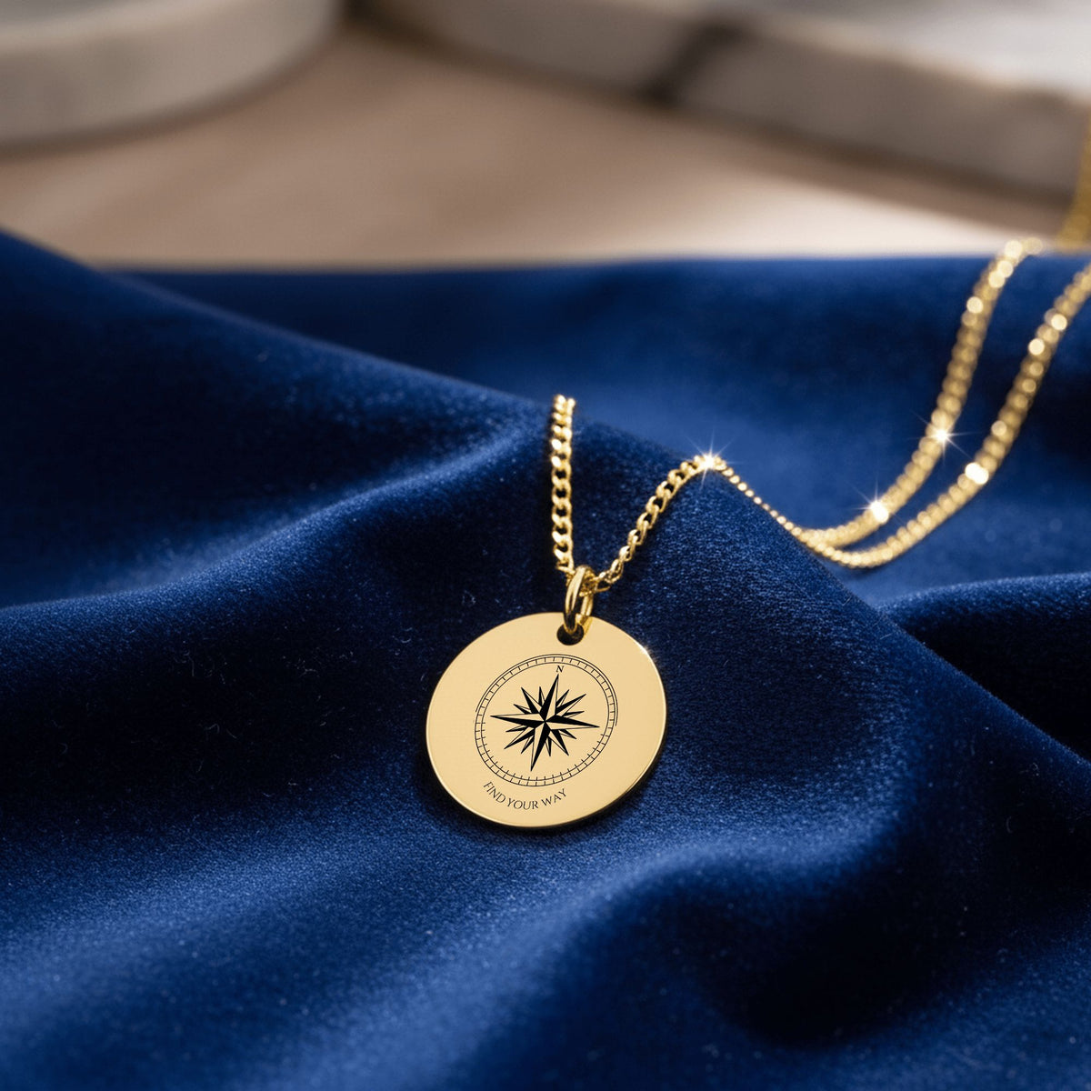 Close-up of the laser engraved compass rose and FIND YOUR WAY coin
