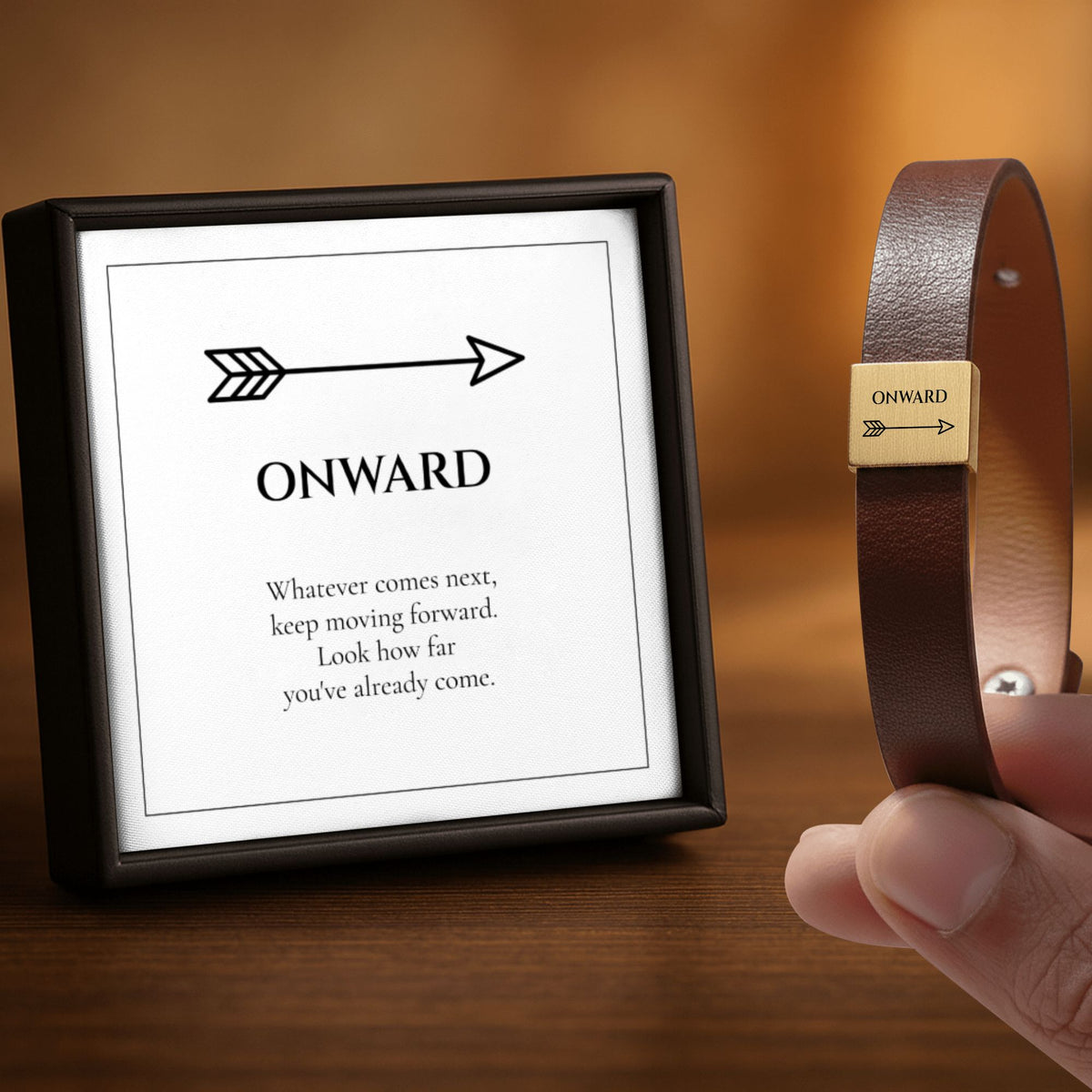 Onward bracelet next to its ONWARD message card in a frame