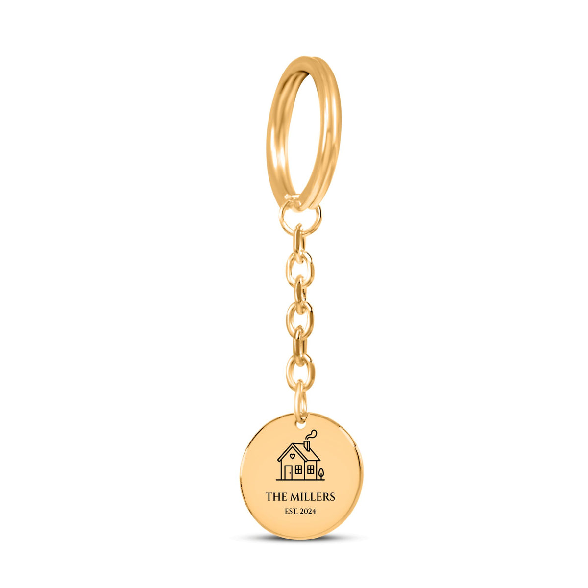 Gold coin keychain engraved with a house, the sample name THE MILLERS and EST. 2024