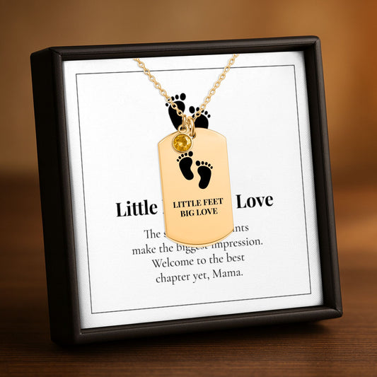 Baby footprints birthstone tag necklace on its Little Feet, Big Love card in a gift box