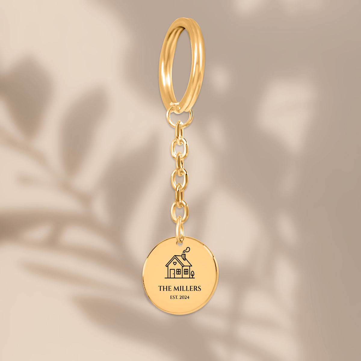 Family name house keychain in soft window light