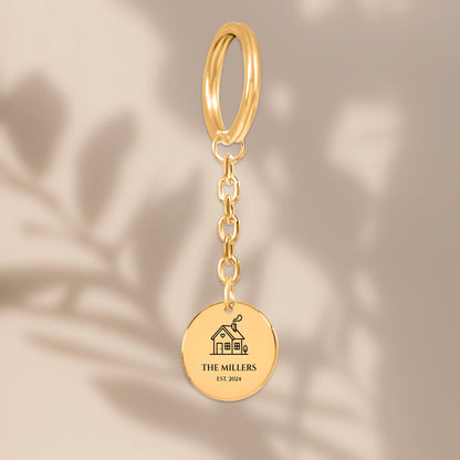 Family name house keychain in soft window light