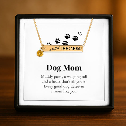 Dog Mom bar necklace with birthstone charm displayed on its message card