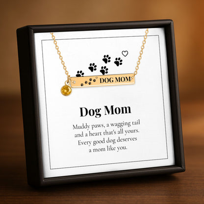 Dog Mom paw print birthstone bar necklace on its Dog Mom card in a gift box