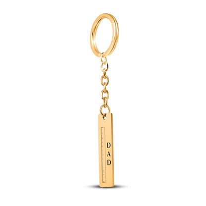 Gold plated vertical bar keychain engraved with a ruler and stacked DAD lettering