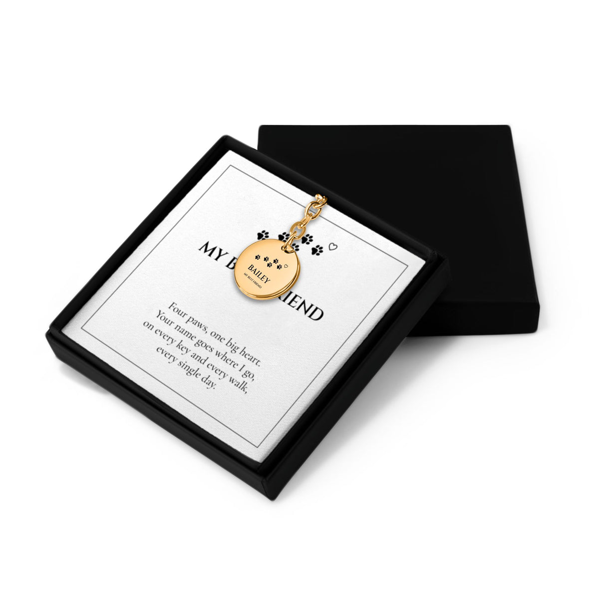 Pet name keychain gift box with the lid off and its message card