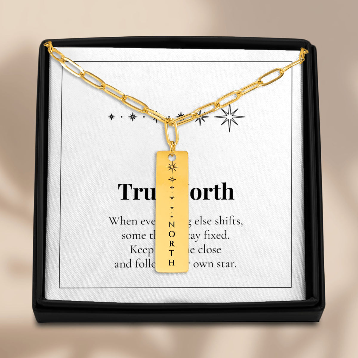 North Star necklace on its True North card in a black gift box